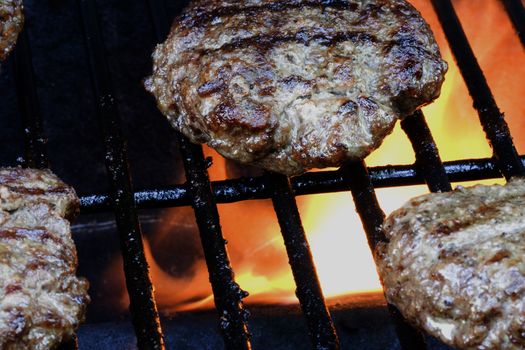 Grilling burgers on the bbq in the backyard for summer fun