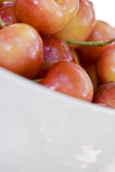 High key shot of a bowl full of cherries