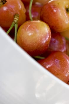 High key shot of a bowl full of cherries