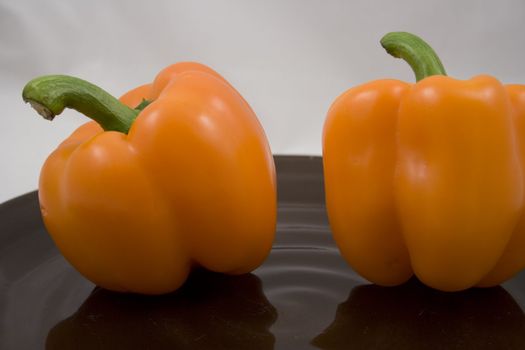 Orange peppers on a plate waiting for the salad
