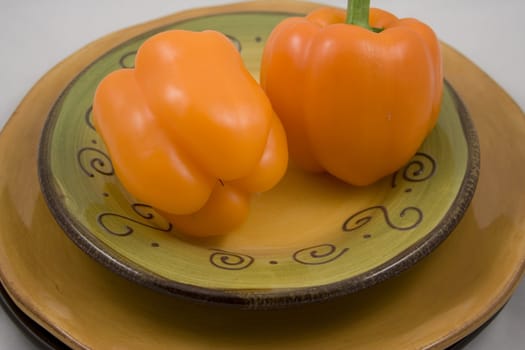 Orange peppers on a plate waiting for the salad
