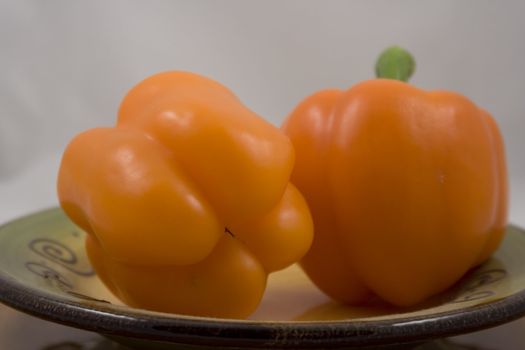 Orange peppers on a plate waiting for the salad
