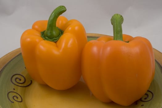 Orange peppers on a plate waiting for the salad
