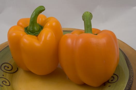 Orange peppers on a plate waiting for the salad
