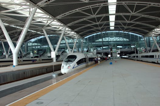 GUANGZHOU, CHINA - SEPTEMBER 29: China invests in fast and modern railway, trains with speed over 340 km/h. Train to Wuhan on September 29, 2010 waits in newly build Guangzhou South station.