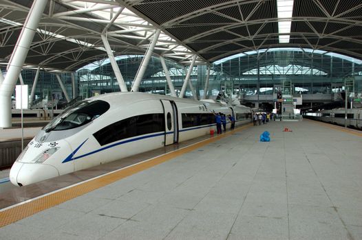 GUANGZHOU, CHINA - SEPTEMBER 29: China invests in fast and modern railway, trains with speed over 340 km/h. Train to Wuhan on September 29, 2010 waits in newly build Guangzhou South station.