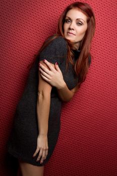 Beautiful redhead grey sweater woman
