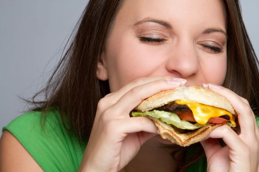 Beautiful girl eating hamburger food