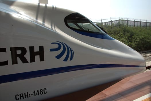 YUEYANG - HUNAN, CHINA - OCTOBER 3: China invests in fast and modern railway, trains with speed over 340 km/h. Modern train approaches station on October 3, 2010 in YueYang station.