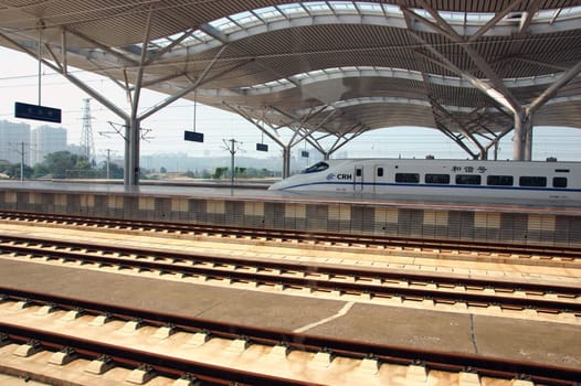 CHANGSHA - HUNAN, CHINA - OCTOBER 3: China invests in fast and modern railway, trains with speed over 340 km/h. Newly build station with trains on platforms on October 3, 2010 in Changsha.