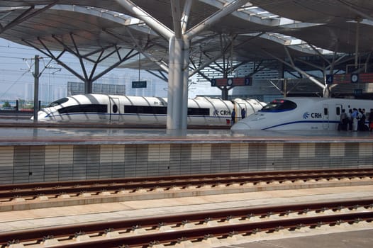 CHANGSHA - HUNAN, CHINA - OCTOBER 3: China invests in fast and modern railway, trains with speed over 340 km/h. Newly build station with trains on platforms on October 3, 2010 in Changsha.