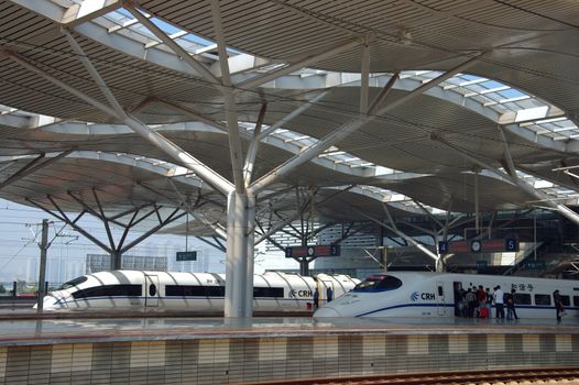 CHANGSHA - HUNAN, CHINA - OCTOBER 3: China invests in fast and modern railway, trains with speed over 340 km/h. Newly build station with trains on platforms on October 3, 2010 in Changsha.