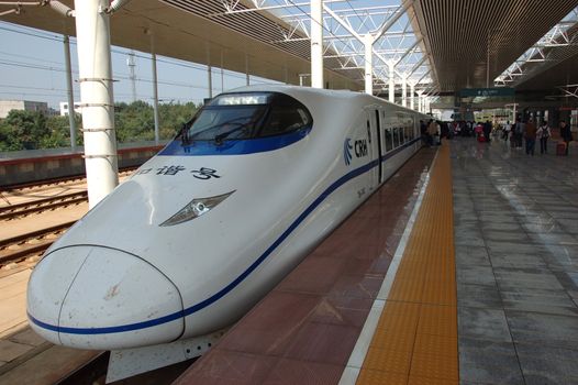 ZHUZHOU - HUNAN, CHINA - OCTOBER 3: China invests in fast and modern railway, trains with speed over 340 km/h. Modern train waits at platform on October 3, 2010 in ZhuZhou station.