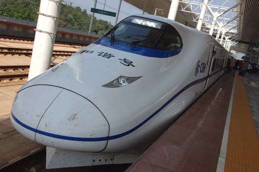 ZHUZHOU - HUNAN, CHINA - OCTOBER 3: China invests in fast and modern railway, trains with speed over 340 km/h. Modern train waits at platform on October 3, 2010 in ZhuZhou station.