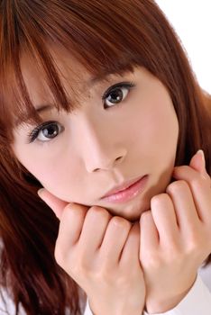 Cute businesswoman of Asian with innocent expression on face, closeup portrait.