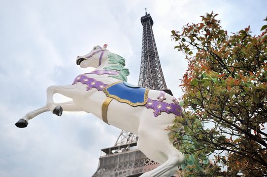 The decorative sculpture galloping horse on background Eiffel tower