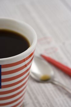 macro of coffee cup on paper