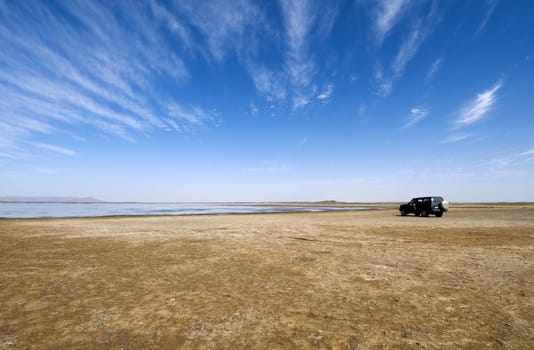 Lake in the Sahara desert with a off-road 4wd car - Near Merzouga - Best of Morocco