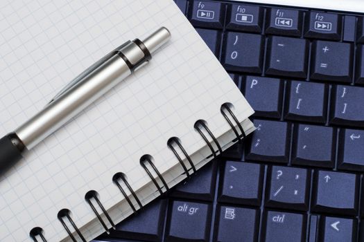 Business objects: pen, diary and a keyboard. Business background for any use