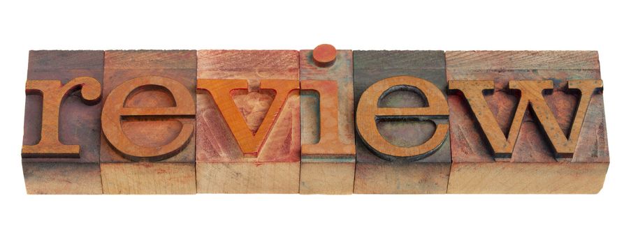 review - word in vintage wooden letterpress printing blocks isolated on white