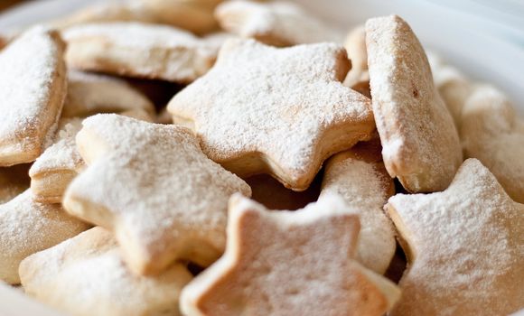 Homemade cookies sprinkled powder sugar.