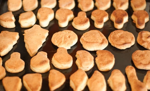 Homemade cookies carefully stacked on the contrary.