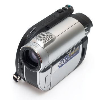 Modern digital camera isolated on a white background. Light shade.