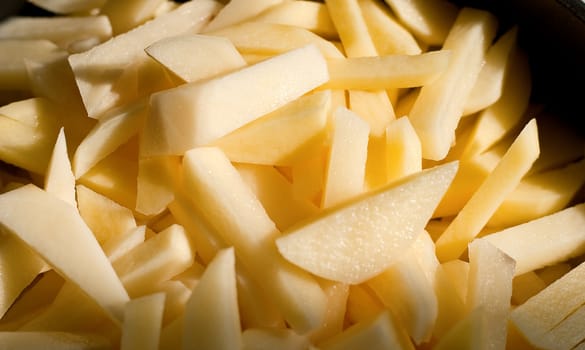 Peeled and chopped potatoes. close-up