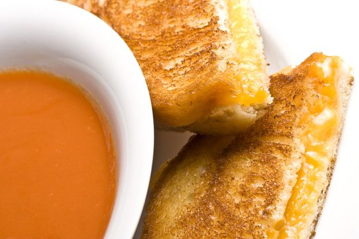 grilled cheese sandwich on a white plate shot with a macro lens