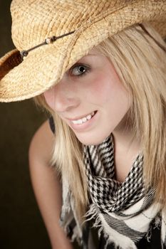 Close up of blonde girl focusing on her blue eye