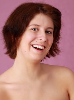 happy caucasian girl with nice smile, pink background