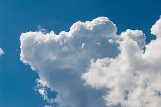 The bright blue sky with grandiose masses of water as clouds