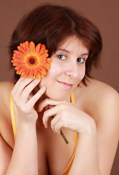 young caucasian woman, naked shoulders, black background