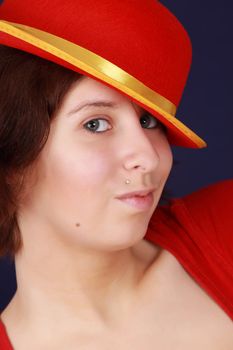 closeup portrait of young woman with red hat