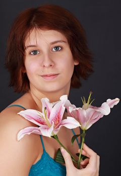 young caucasian woman with lily flowers