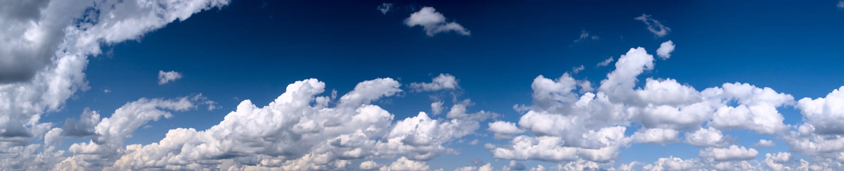 Panorama of bright blue sky with clouds
