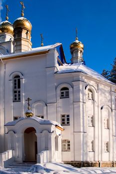 Fragment of building an Orthodox church. Winter, snow, sun, Russia, earlier morning. 