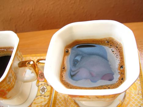 black coffee square cup with woman face reflection