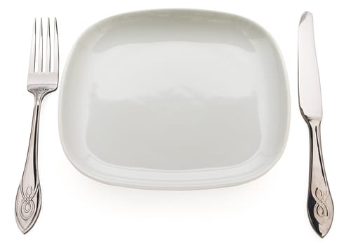 Table set: plate, fork, spoon and table knife. Concept of food