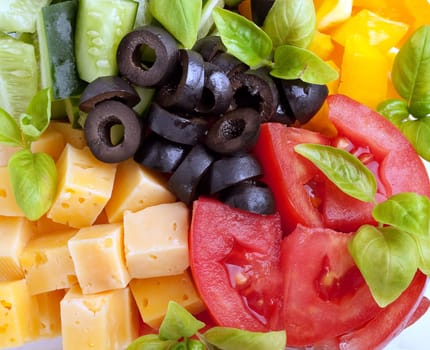 Salad Ingredients: tomatoes, cucumbers, olives and cheese
