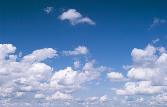 Cumulus clouds against blue sky