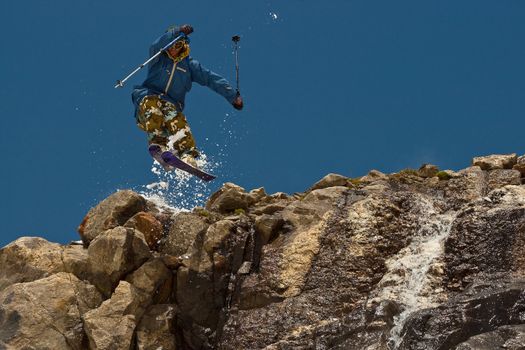 Freerider jumping in a mountains, Caucasus, Elbrus, summer