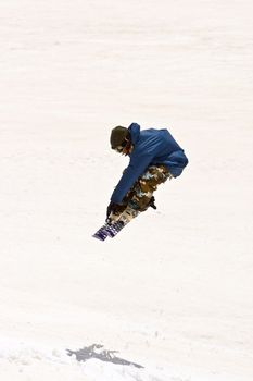 Freerider jumping in a mountains, Caucasus, Elbrus, summer