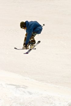 Freerider jumping in a mountains, Caucasus, Elbrus, summer