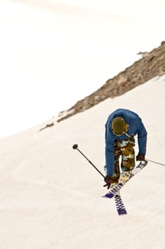 Freerider jumping in a mountains, Caucasus, Elbrus, summer