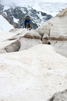 Freerider jumping in a mountains, Caucasus, Elbrus, summer