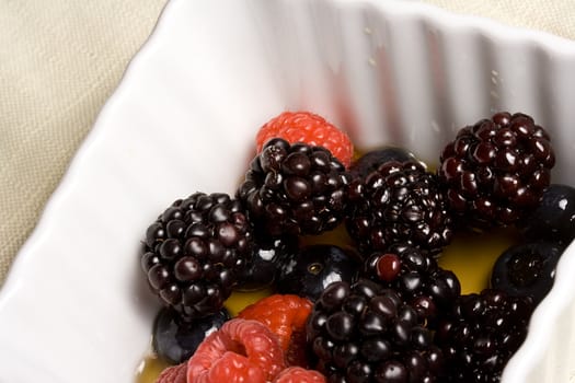 healthy white bowl of ripe fruit in syrup 