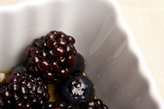 healthy white bowl of ripe fruit in syrup 