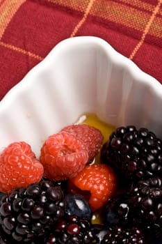 healthy white bowl of ripe fruit in syrup 