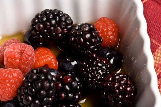 healthy white bowl of ripe fruit in syrup 